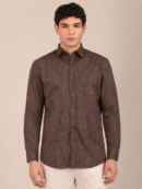 Men’s cocoa brown leaf print shirt styled with beige trousers front-1