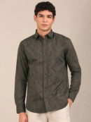 Model wearing a men’s dark olive leaf print slim fit shirt