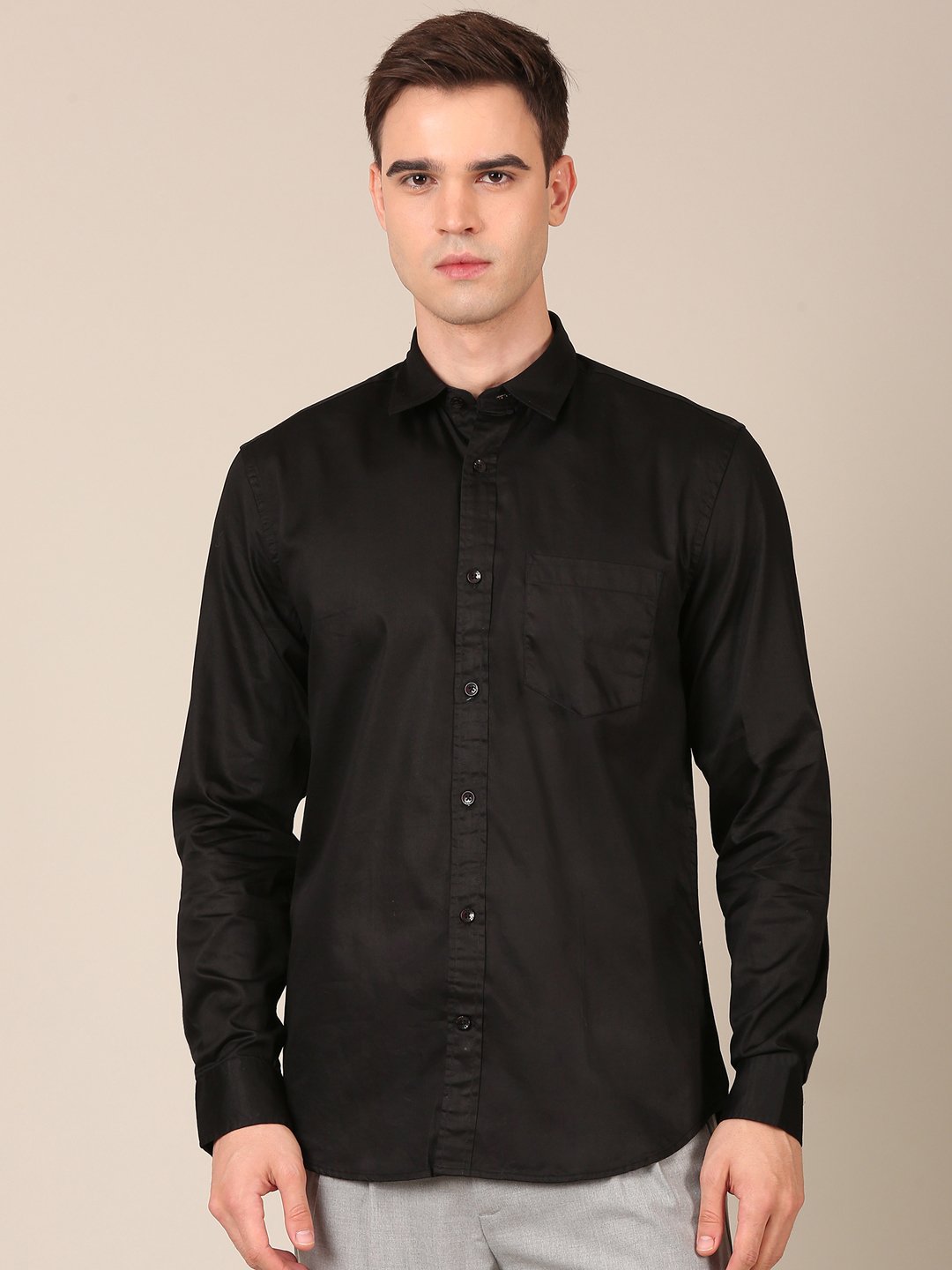 Model wearing a black satin shirt for men front