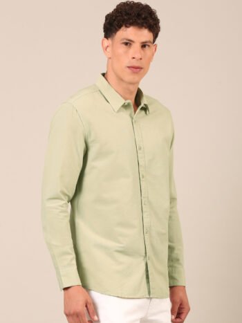 Model wearing a sage green regular fit shirt for men side2